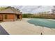 Clubhouse featuring a large pool and surrounding patio at 4125 Madison Bridge Dr, Suwanee, GA 30024