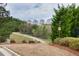 Neighborhood trail surrounded by lush greenery and trees at 4125 Madison Bridge Dr, Suwanee, GA 30024