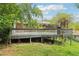 A spacious back deck on a brick home provides an excellent space for outdoor entertaining and relaxation at 454 Jo Ann Se Dr, Marietta, GA 30067