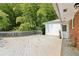 A spacious deck with weathered wood, connects to a side door and is surrounded by greenery at 454 Jo Ann Se Dr, Marietta, GA 30067