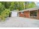 Backyard deck connected to brick home with sliding glass door and a side door at 454 Jo Ann Se Dr, Marietta, GA 30067