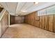 Unfinished basement with paneled walls and tile flooring at 454 Jo Ann Se Dr, Marietta, GA 30067