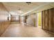 Spacious unfinished basement featuring paneled walls, bench, and tile flooring at 454 Jo Ann Se Dr, Marietta, GA 30067