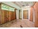 Unfinished basement featuring wood paneled walls and vinyl flooring at 454 Jo Ann Se Dr, Marietta, GA 30067