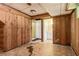 Unfinished basement featuring wood paneled walls and vinyl flooring at 454 Jo Ann Se Dr, Marietta, GA 30067
