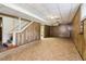 Unfinished basement with paneled walls, stairs to upper level, and tile flooring at 454 Jo Ann Se Dr, Marietta, GA 30067