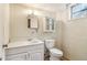 Basement bathroom featuring white vanity, medicine cabinet, and standard toilet at 454 Jo Ann Se Dr, Marietta, GA 30067