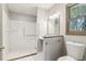 Bathroom featuring a walk-in shower, white tile, vanity and updated fixtures at 454 Jo Ann Se Dr, Marietta, GA 30067