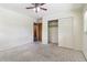 This carpeted bedroom offers a ceiling fan and closet for storage at 454 Jo Ann Se Dr, Marietta, GA 30067