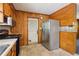 Kitchen area featuring wooden cabinets, laminate countertops, and stainless-steel appliances at 454 Jo Ann Se Dr, Marietta, GA 30067