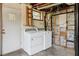 Basement laundry area featuring washer and dryer hookups and exposed plumbing at 454 Jo Ann Se Dr, Marietta, GA 30067