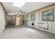 A sunroom featuring neutral walls, a ceiling fan, and natural light streaming through the windows and skylight at 454 Jo Ann Se Dr, Marietta, GA 30067