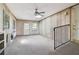 A sunroom featuring neutral walls, a ceiling fan, and natural light streaming through the windows and skylight at 454 Jo Ann Se Dr, Marietta, GA 30067