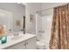 Bathroom featuring vanity with ample storage, decorative shower curtain, and art at 552 Micayne Se Cir # 1, Smyrna, GA 30082