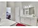 Bathroom vanity area with closet featuring wire shelving and ample space at 552 Micayne Se Cir # 1, Smyrna, GA 30082