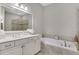 Light and bright bathroom featuring a soaking tub and double sink vanity at 552 Micayne Se Cir # 1, Smyrna, GA 30082