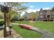 Scenic view of the townhome community featuring lush green space and a quaint walking bridge at 552 Micayne Se Cir # 1, Smyrna, GA 30082