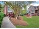 Picturesque community with lush lawns, mature trees, and charming red footbridges, creating a serene ambiance at 552 Micayne Se Cir # 1, Smyrna, GA 30082