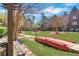 Beautifully landscaped community with walking paths and a charming red footbridge, perfect for leisurely strolls at 552 Micayne Se Cir # 1, Smyrna, GA 30082