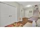 Spacious foyer featuring hardwood floors, coat closet, and staircase at 552 Micayne Se Cir # 1, Smyrna, GA 30082