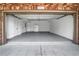 Spacious two-car garage with epoxy flooring, ideal for parking and extra storage space at 552 Micayne Se Cir # 1, Smyrna, GA 30082