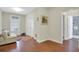 Hallway with hardwood floors, closet doors, and access to the bathroom at 552 Micayne Se Cir # 1, Smyrna, GA 30082