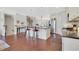 Bright open-concept kitchen with stainless steel appliances, island seating, and hardwood floors at 552 Micayne Se Cir # 1, Smyrna, GA 30082