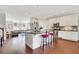 Bright open-concept kitchen with stainless steel appliances, island seating, and hardwood floors at 552 Micayne Se Cir # 1, Smyrna, GA 30082