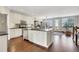 Bright open-concept kitchen with stainless steel appliances, island seating, and hardwood floors at 552 Micayne Se Cir # 1, Smyrna, GA 30082