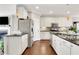 Bright kitchen features stainless appliances, granite countertops, and eat-in area with lots of natural light at 552 Micayne Se Cir # 1, Smyrna, GA 30082