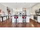 Bright open-concept kitchen with stainless steel appliances, island seating, and hardwood floors at 552 Micayne Se Cir # 1, Smyrna, GA 30082