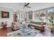 Inviting living room featuring a comfortable sectional sofa, hardwood floors, and ample natural light at 552 Micayne Se Cir # 1, Smyrna, GA 30082
