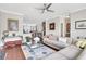 Spacious living room featuring a sectional sofa, hardwood floors, and a view into adjacent rooms at 552 Micayne Se Cir # 1, Smyrna, GA 30082