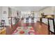 Open-concept living room and kitchen with hardwood floors, island seating, and modern appliances at 552 Micayne Se Cir # 1, Smyrna, GA 30082