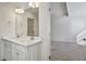 Stylish bathroom featuring double sinks, white cabinets, and a large mirror at 2240 Mulsanne Dr, Lithonia, GA 30058