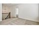 Upstairs hallway featuring wood and metal railing, and neutral carpet at 2240 Mulsanne Dr, Lithonia, GA 30058