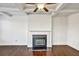 Bright living room featuring coffered ceilings, modern fireplace, and hardwood floors at 2240 Mulsanne Dr, Lithonia, GA 30058