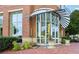 Building entrance with well manicured landscaping and brick walkway at 325 E Paces Ferry Ne Rd # 810, Atlanta, GA 30305