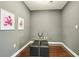 Dining room with dark hardwood floors, grey walls, white trim, and a glass table with stools at 325 E Paces Ferry Ne Rd # 810, Atlanta, GA 30305