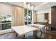 Bright game room with ping pong table, large windows, and cozy decor with a Scrabble board at 325 E Paces Ferry Ne Rd # 810, Atlanta, GA 30305