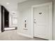 Hallway view featuring carpet, wall art, a fire extinguisher, and a door to a unit at 325 E Paces Ferry Ne Rd # 810, Atlanta, GA 30305