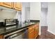 Updated kitchen with stainless steel appliances, a double sink, and wood cabinets at 325 E Paces Ferry Ne Rd # 810, Atlanta, GA 30305