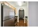 View of the updated kitchen with stainless steel appliances, wood cabinets, and granite countertops at 325 E Paces Ferry Ne Rd # 810, Atlanta, GA 30305