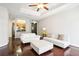 Bright living room features hardwood floors, neutral paint, fan, and an eat-in kitchen view at 325 E Paces Ferry Ne Rd # 810, Atlanta, GA 30305