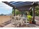 Stylish outdoor lounge area with dining table and comfortable seating under a pergola at 325 E Paces Ferry Ne Rd # 810, Atlanta, GA 30305