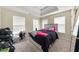 Bright bedroom with multiple windows and carpeted flooring. Lots of storage space at 552 Trotters Ln, Mcdonough, GA 30252
