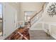 Inviting entryway with natural light, staircase with wooden handrail, and decorative accents at 552 Trotters Ln, Mcdonough, GA 30252