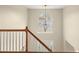 Bright two-story foyer featuring a staircase, arched window and modern chandelier at 552 Trotters Ln, Mcdonough, GA 30252