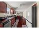 Bright kitchen featuring stainless steel appliances, hardwood floors and view to the living area at 552 Trotters Ln, Mcdonough, GA 30252