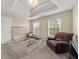 Main bedroom with carpet flooring, trey ceilings and lots of natural light at 552 Trotters Ln, Mcdonough, GA 30252